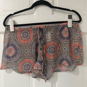 Lightly worn H&M sheer beach shorts cover up with multicolor design